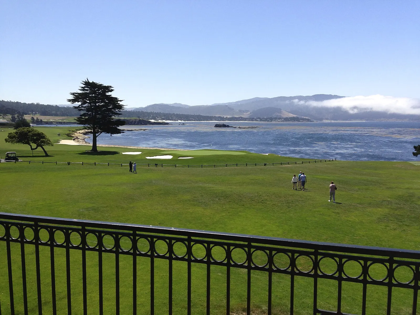 The 18th green at Pebble Beach Golf Links along Carmel Bay