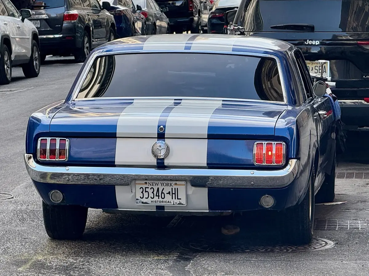 Rear view of a 1965 Ford Mustang with its tri-bar taillights