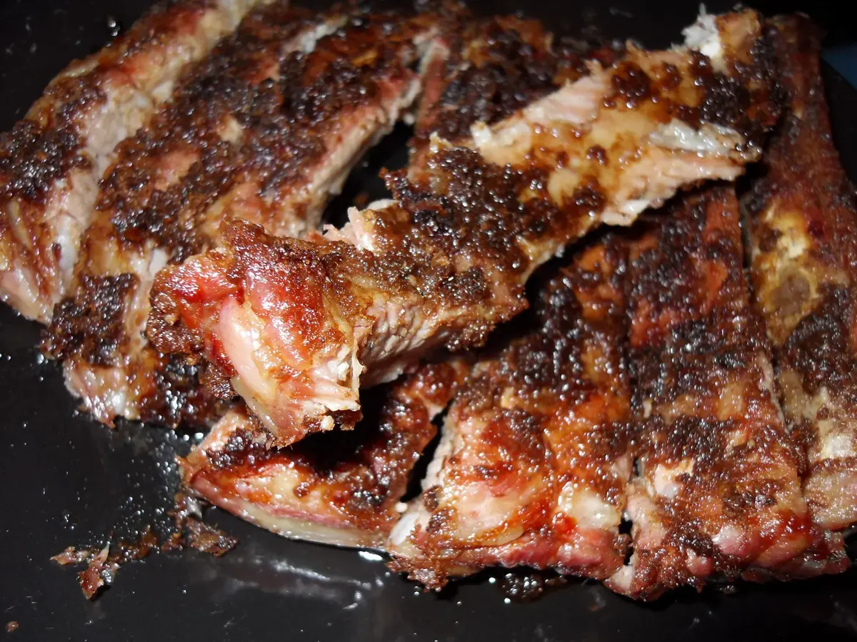 A rack of sauced spare ribs